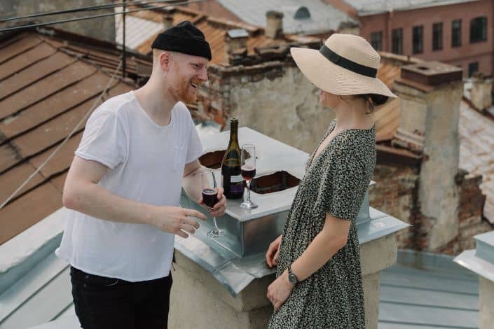 Man and woman talking while drinking wine