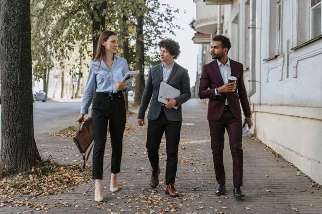 Colleagues Having A Conversation On Sidewalk - Close Ended Questions