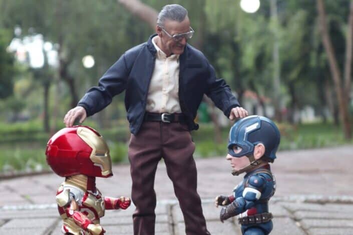 man with iron man and captain america toy