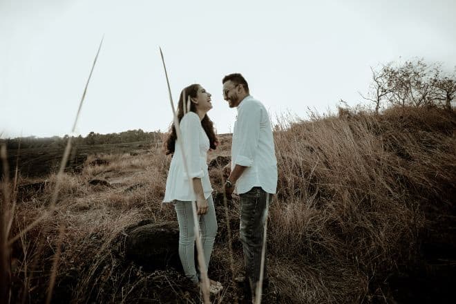 Man and Woman Laughing on a Field - Funny Couple Name