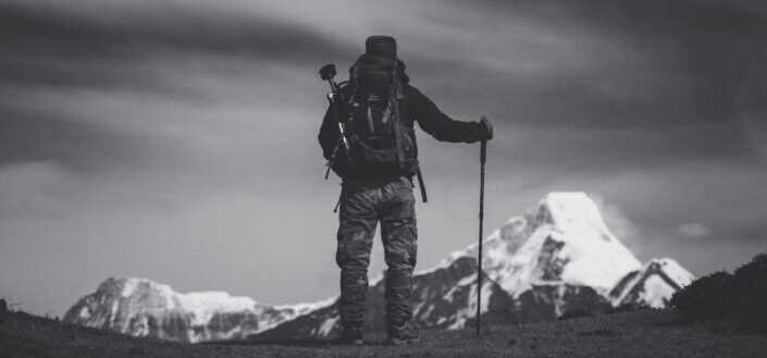Hiking man looking at a mountain