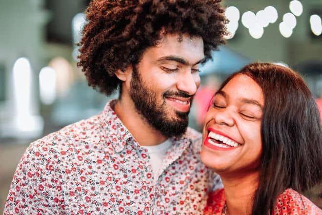 Woman Laughing Beside a Bearded Man - How to Make a Girl Happy