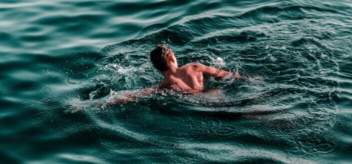 Man Swimming in the Ocean