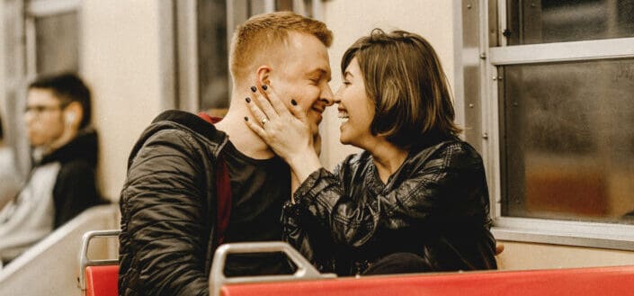 Man and Woman Sitting Inside a Bus