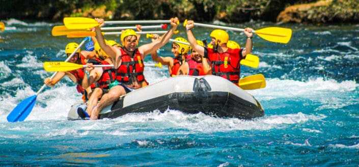 People Riding on Inflatable Raft