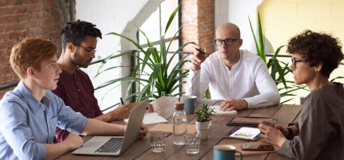 People Sitting in their Office While Discussing