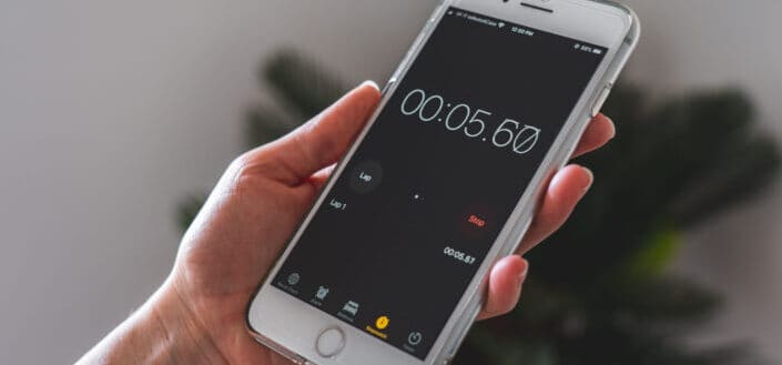 Person Holding Phone Watching Stopwatch