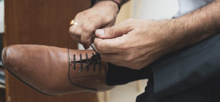 Man tying his shoe lace