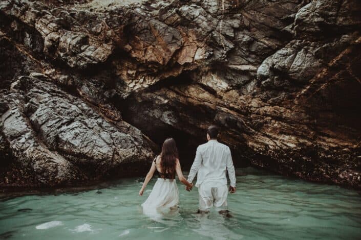 man holding hands while in lake