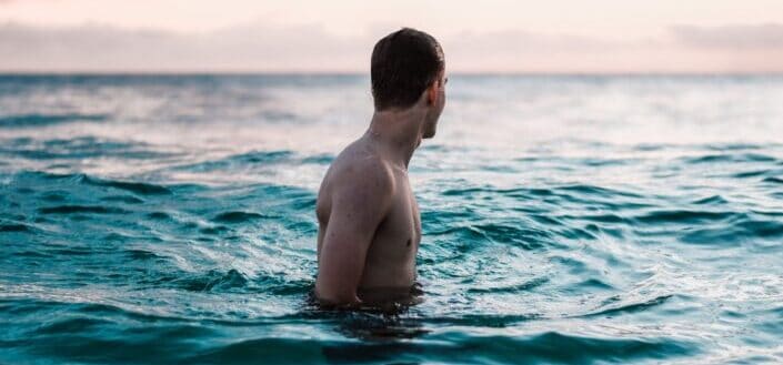 Man in the Ocean During Daytime