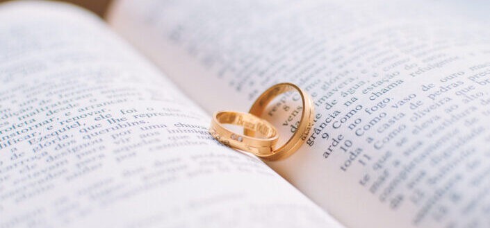 set of wedding bands on bible