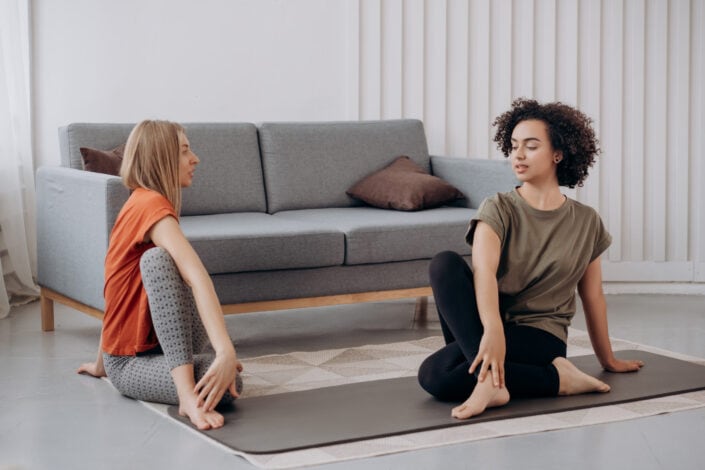 Two women doing yoga