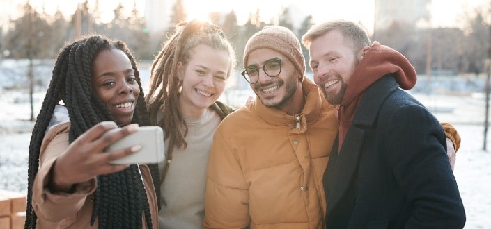 Friends Taking a Selfie During Winter