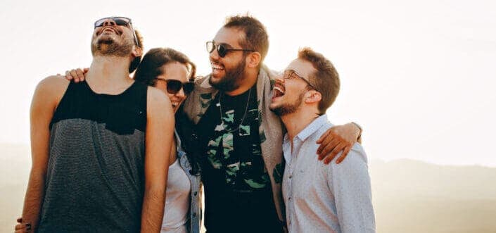 friends laughing together at daytime