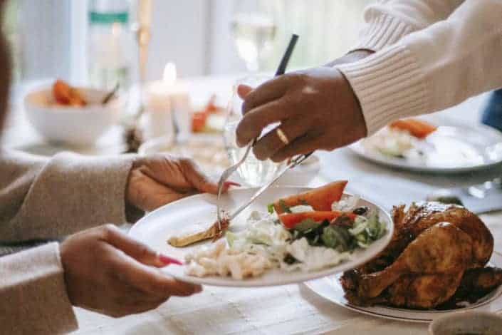 person serving someone with meat