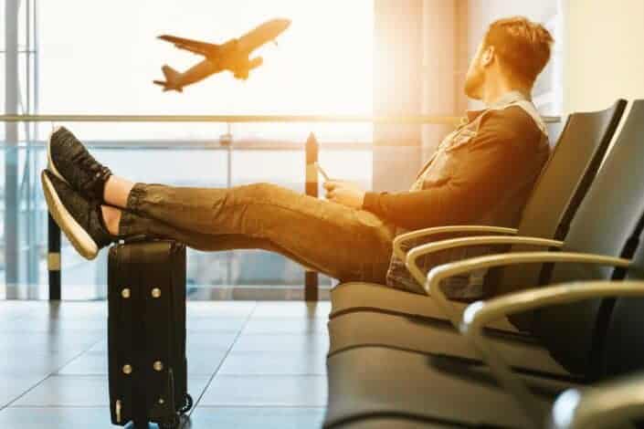 Man sitting while waiting for his flight
