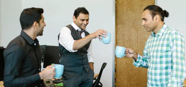 Office men drinking coffee at breaktime