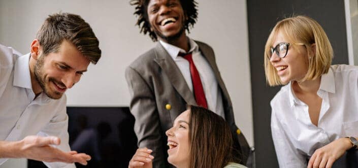 Young office professionals laughing together