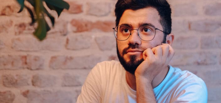 thoughtful man in glasses