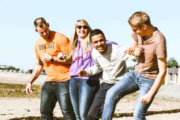 four people having fun under the sun