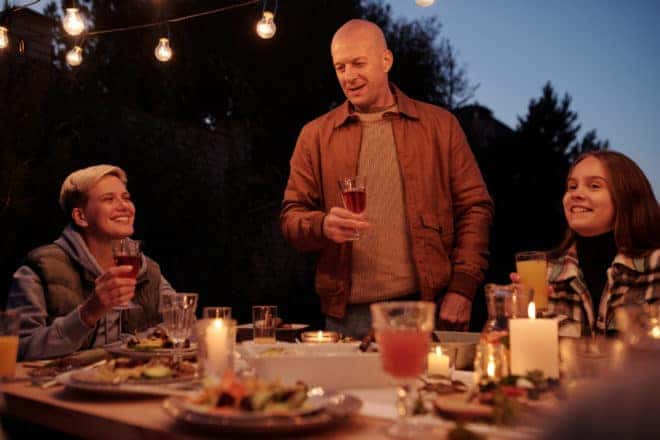 Friends Enjoying an Outside Dinner - Christmas Puns