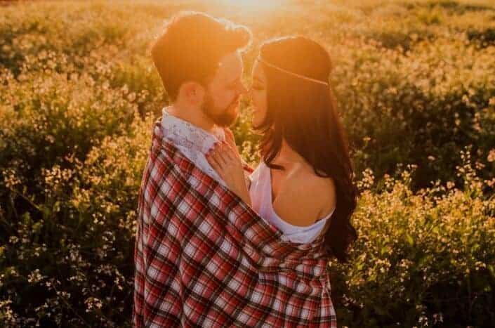 couple cuddling during sunset