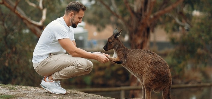 man holding hands with a Kangaroo