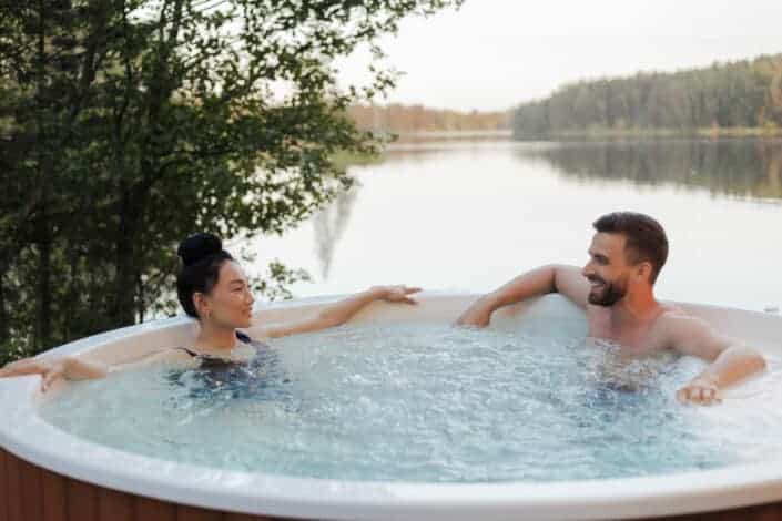 Couple dipped on a round jacuzzi