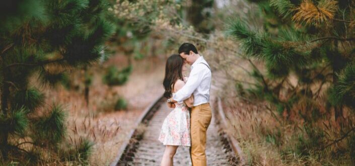 Couple on railroad
