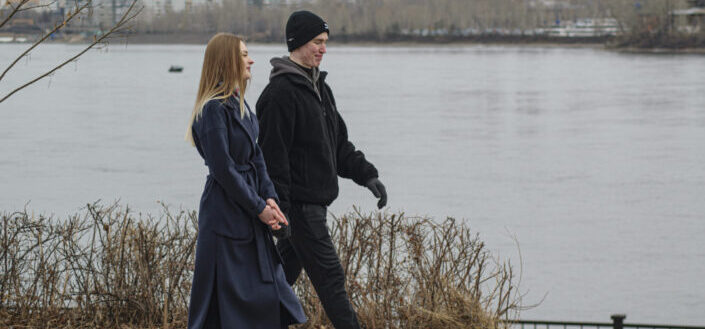 Couple Walking Along the River