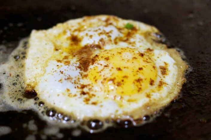 Fried egg with seasonings