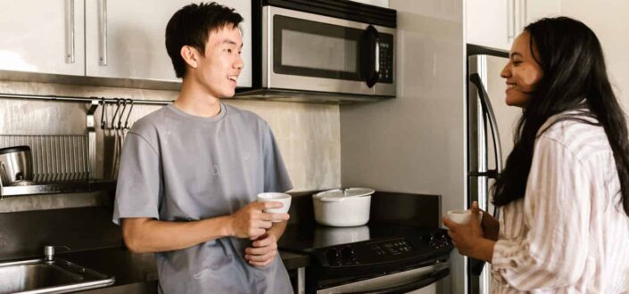 Friends having coffee at the kitchen