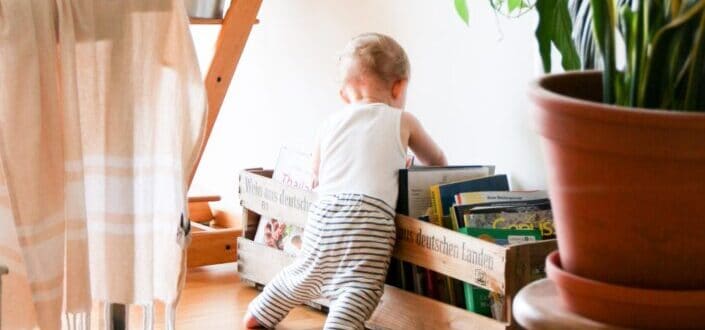 A kid playing in a living room