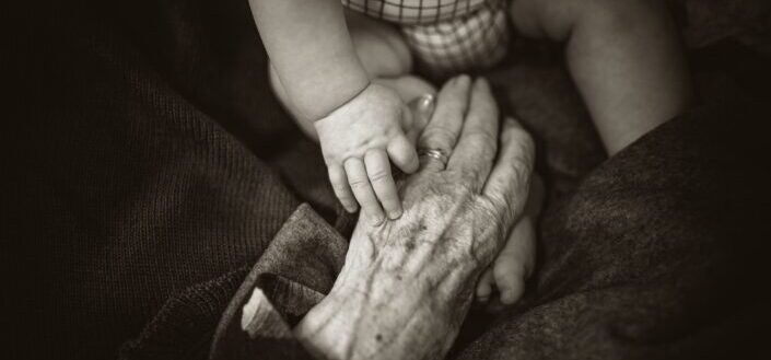 grandmother holding her grandchild