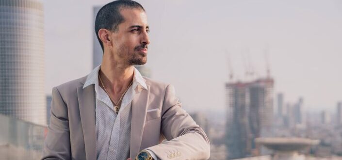 Male in a casual suit on roof top