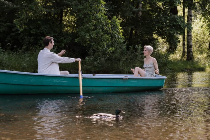 Couple on a small boat talking to each other