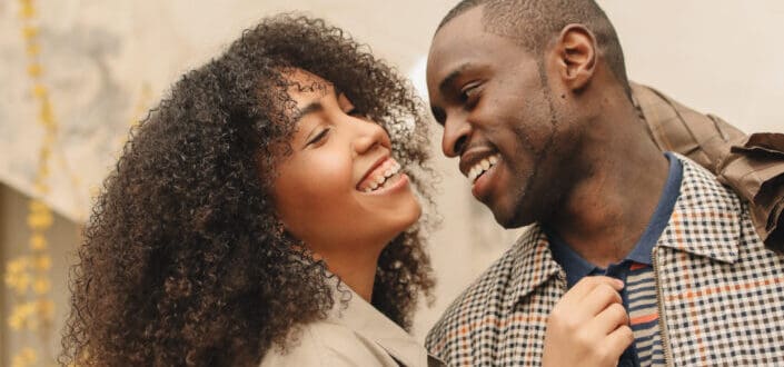 Couple sweetly laughing at each other