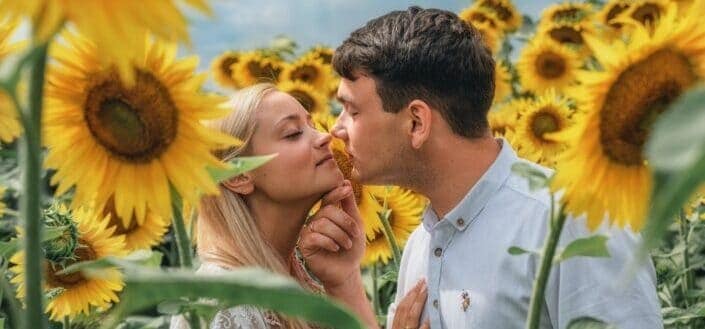 romantic couple in a sunflower field