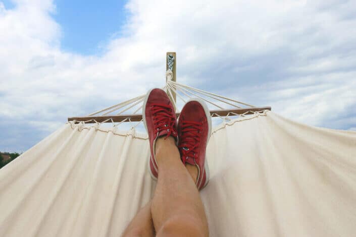 Person in Red Sneakers Lying on a Hammock