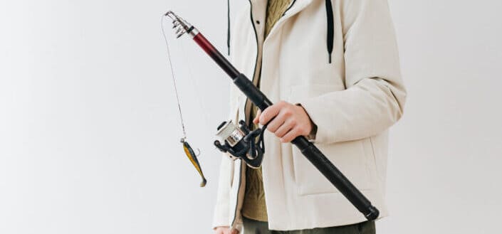 Person Holding a Fishing Rod