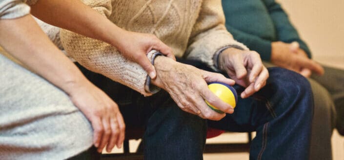 Old Person Holding a Stress Ball
