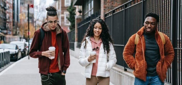 Three friends walking together