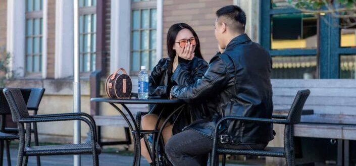 Couple in Jackets Talking to Each Other