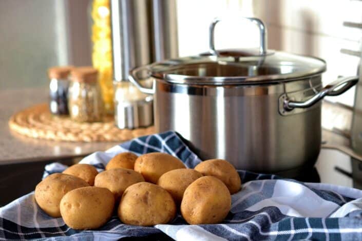 Potatoes Beside Stainless Steel Cooking Pot
