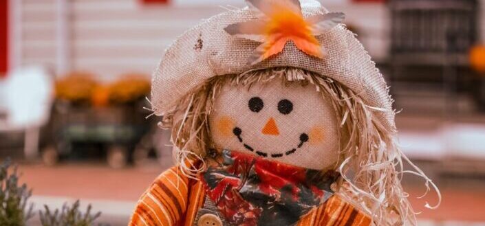 cute scarecrow during a small town fall festival