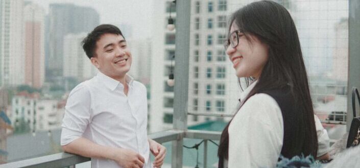 Smiling couple on a balcony