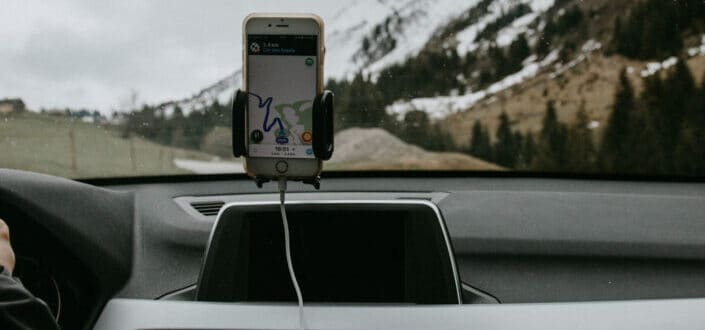 Snowy mountains through windshield of car