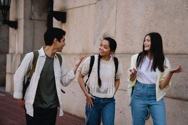 A Group of Friends Talking While Walking - This or That Questions for Teens