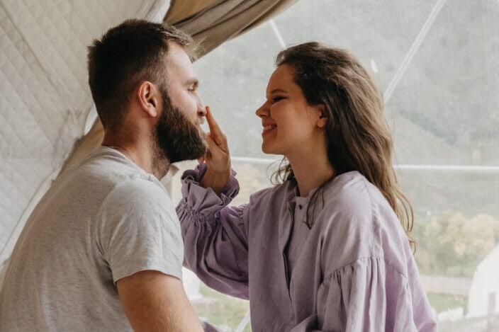 Wife touching husband's nose