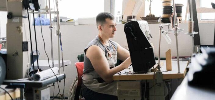 A man using industrial sewing machine